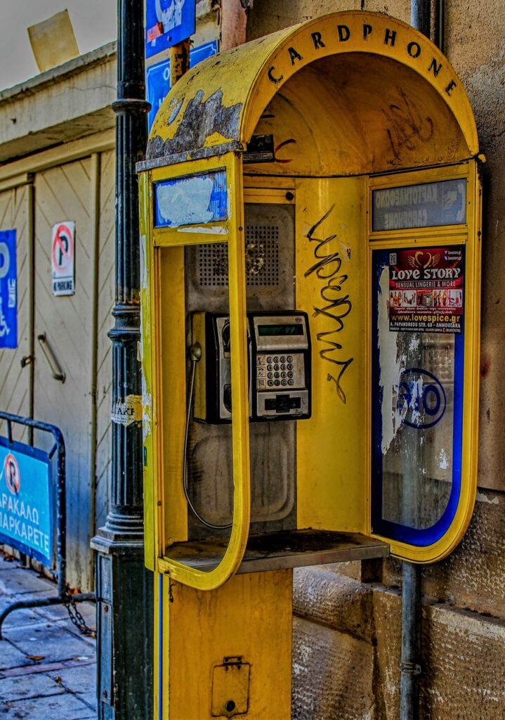 phone booth, payphone, yellow, grafffitti, make a phone call, phone, call up, communication, telephone, telephone booth, old, dispensary, telephone system, unfashionable, telephone set, apparatus, antiquated, connection, call, technology, contact