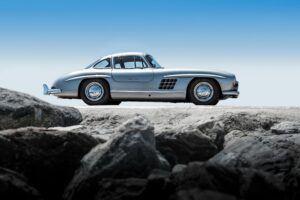Classic Mercedes 300SL captured against a clear blue sky, showcasing its timeless design.